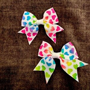 Bold rainbow hearts on white ribbons pigtail bows